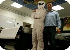 A C E F E E Ce A D Ad D Owner of FASTSIGNS Swansea, Simon Rees and pal Stig test drive his new flat bed printer